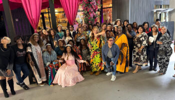 Black women over 40 in Atlanta gathered together smiling and celebrating at a sold-out Us Over 40s Friends Group event
