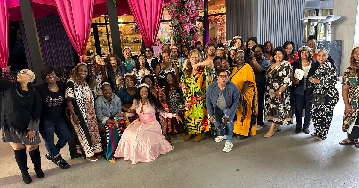 Black women over 40 in Atlanta gathered together smiling and celebrating at a sold-out Us Over 40s Friends Group event